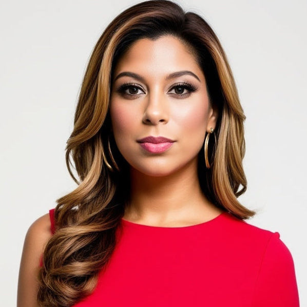Dr. Jamie J. Karia's bio picture. She is wearing a red dress with a plain background

